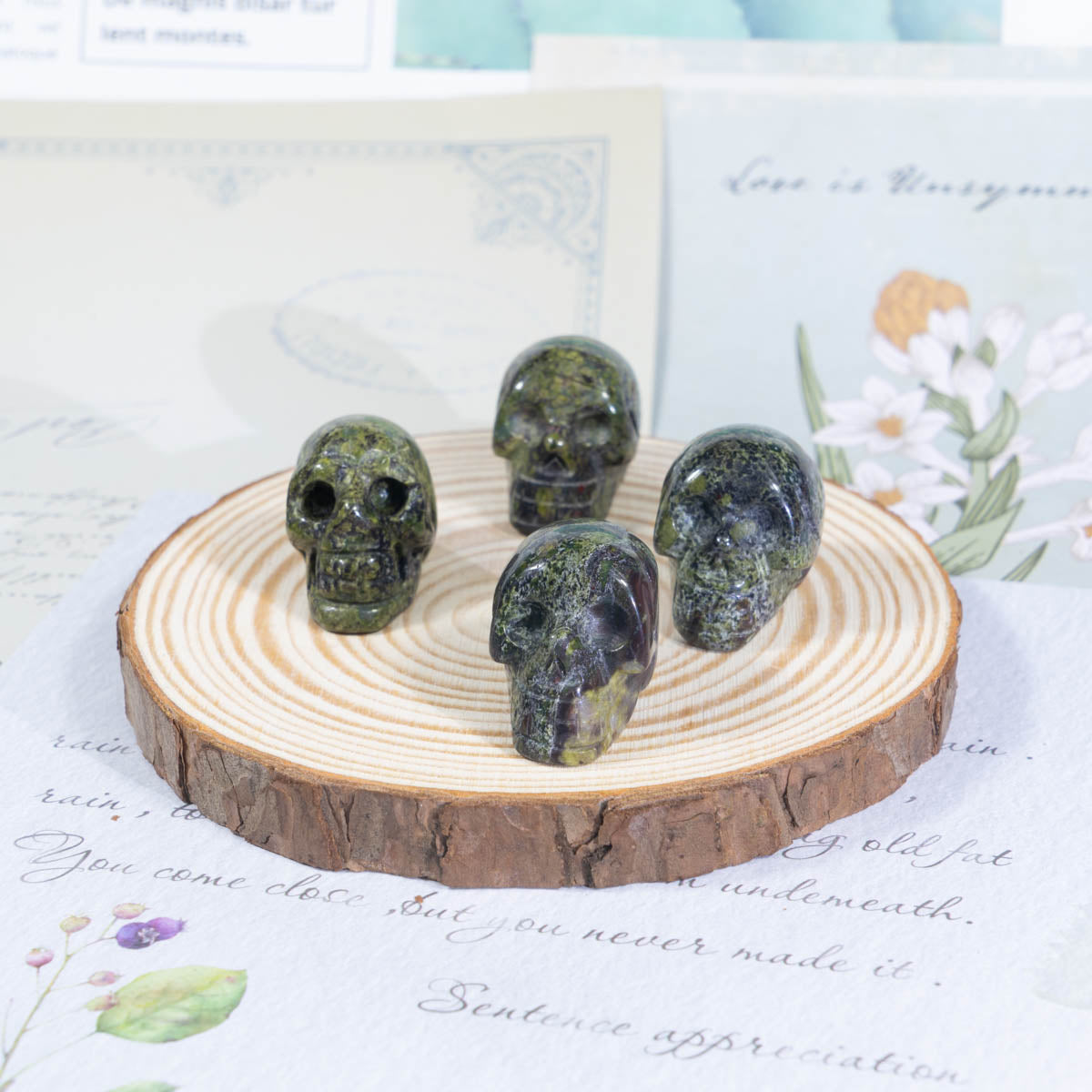 1-Inch Dragon Blood Stone Skull In Bulk